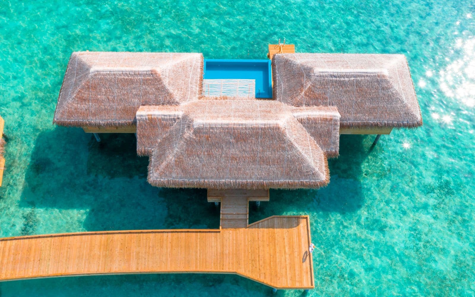 Overwater villa in a turquoise Maldives lagoon